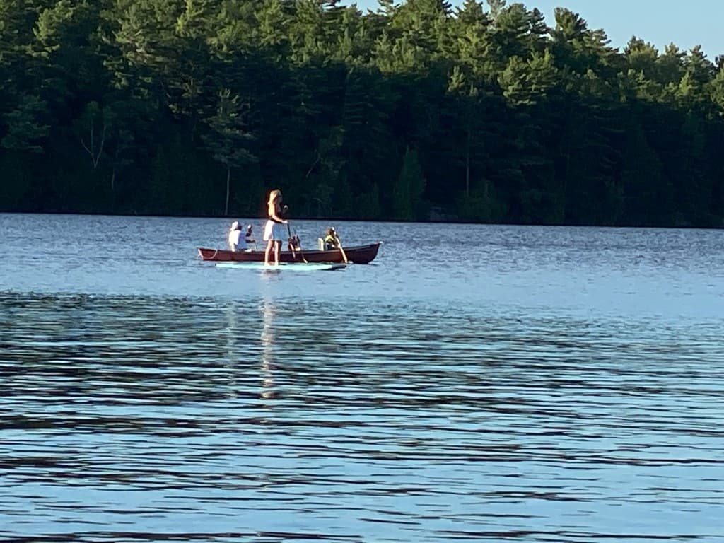 Water sports on Big Gull Lake — paddleboarding, swimming, dock jumping
