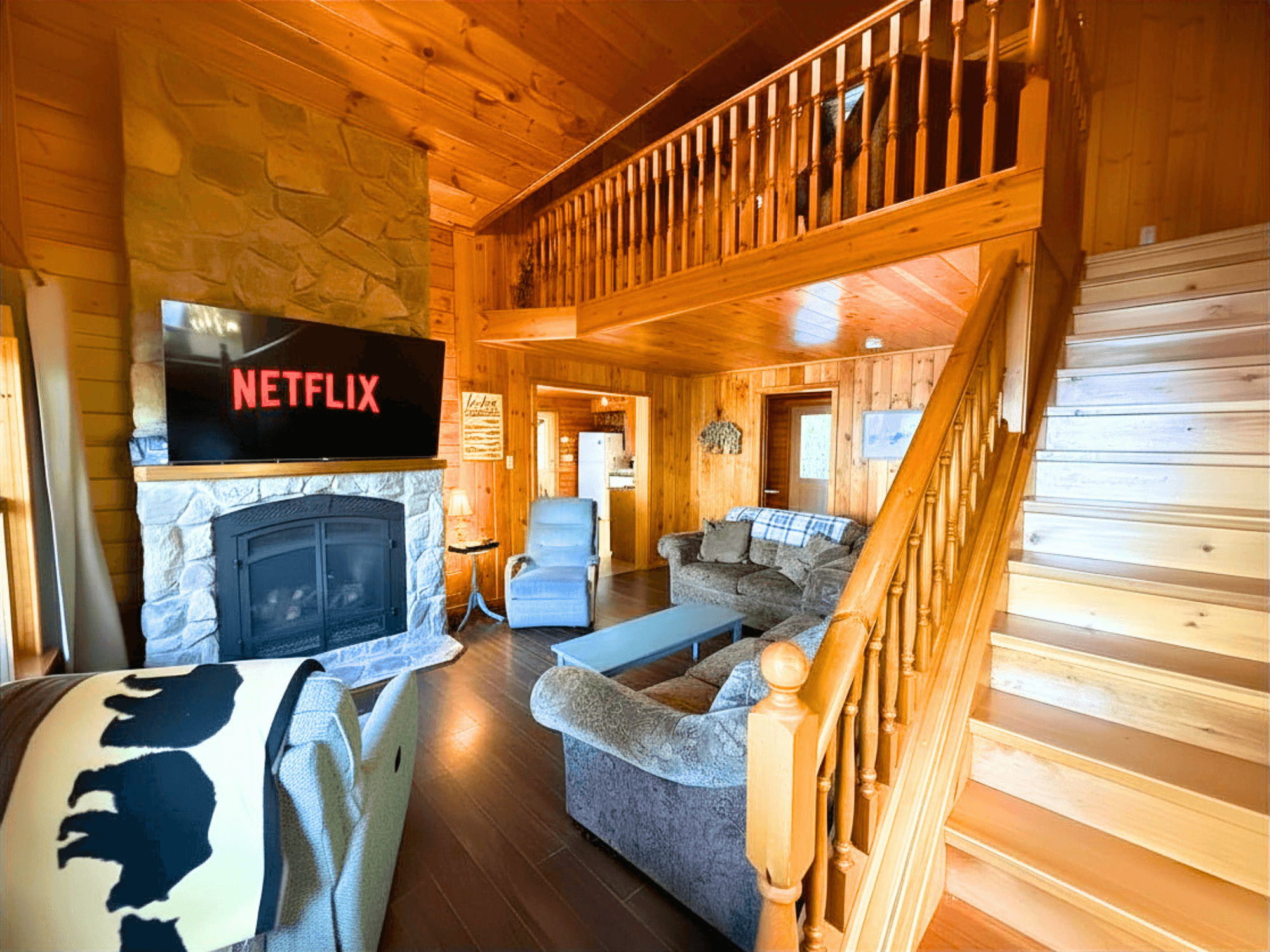 Great room — fireplace and lake view window