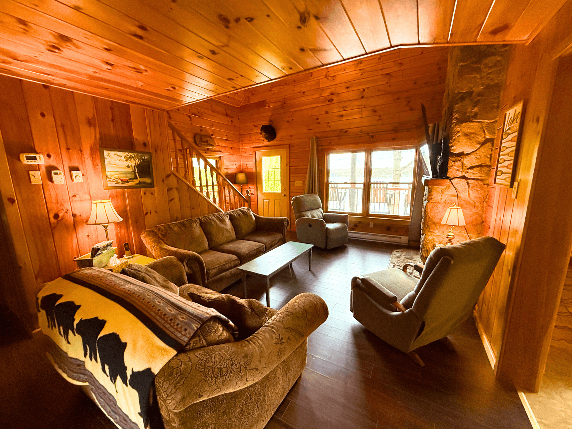 Great room — vaulted pine ceilings and seating