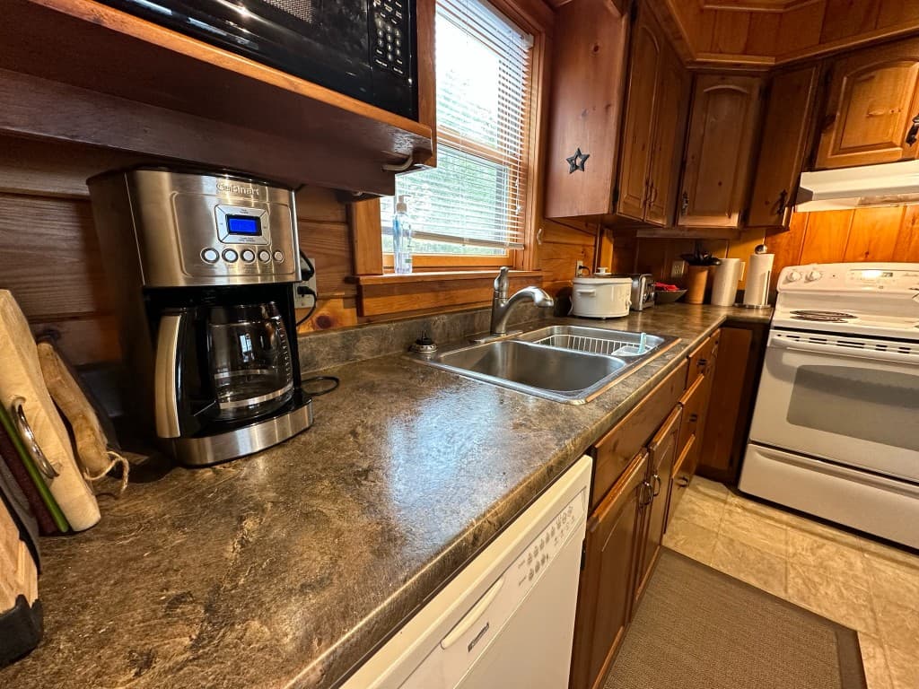 Kitchen — coffee maker, sink, and dishwasher