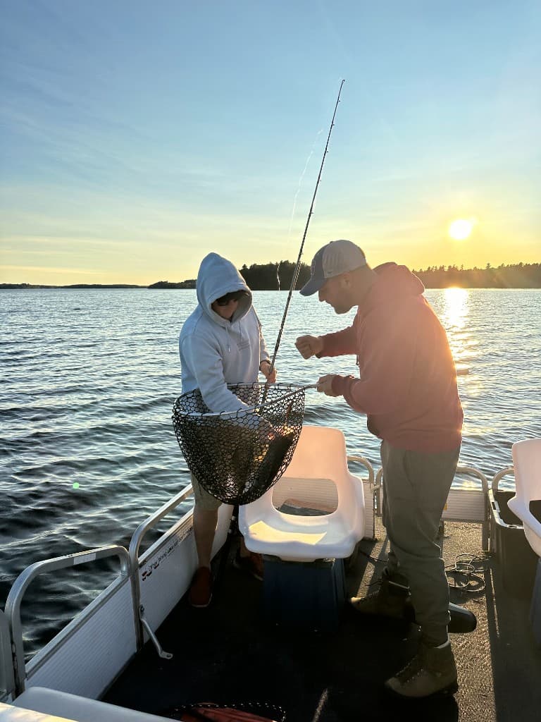 Fishing from an island campsite at sunset