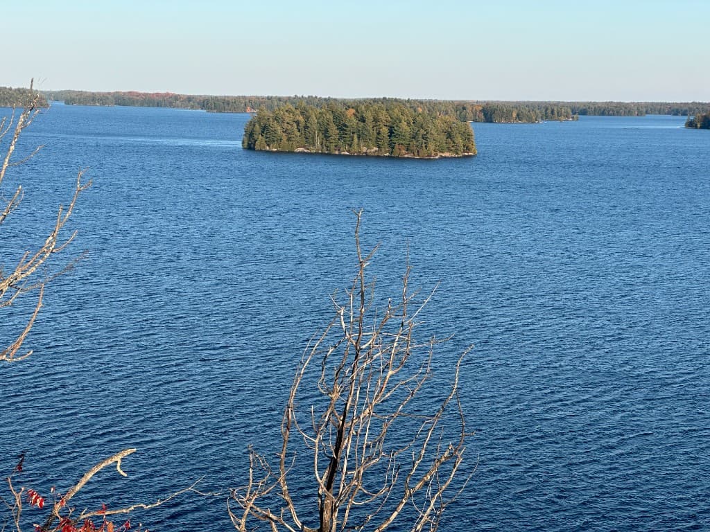 Backcountry island campsite on Big Gull Lake at sunset