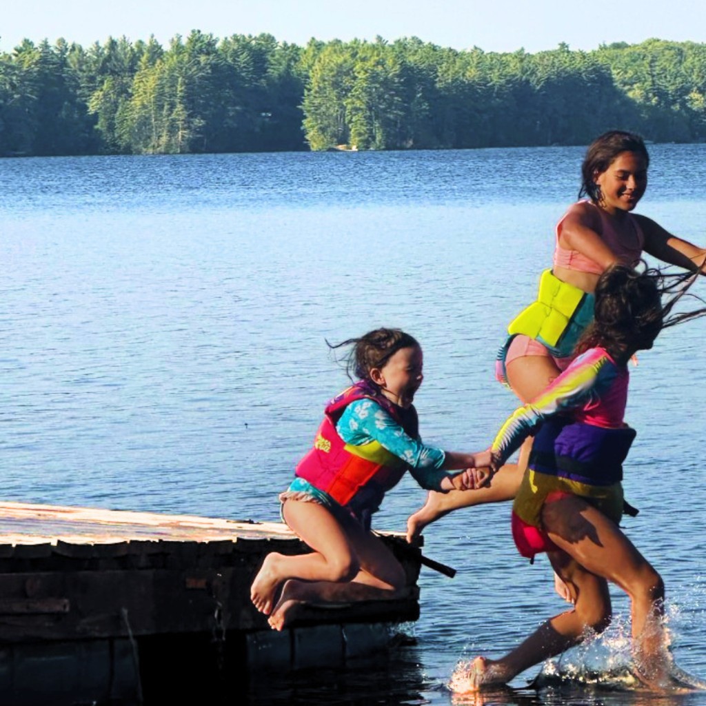 Kids jumping off the dock